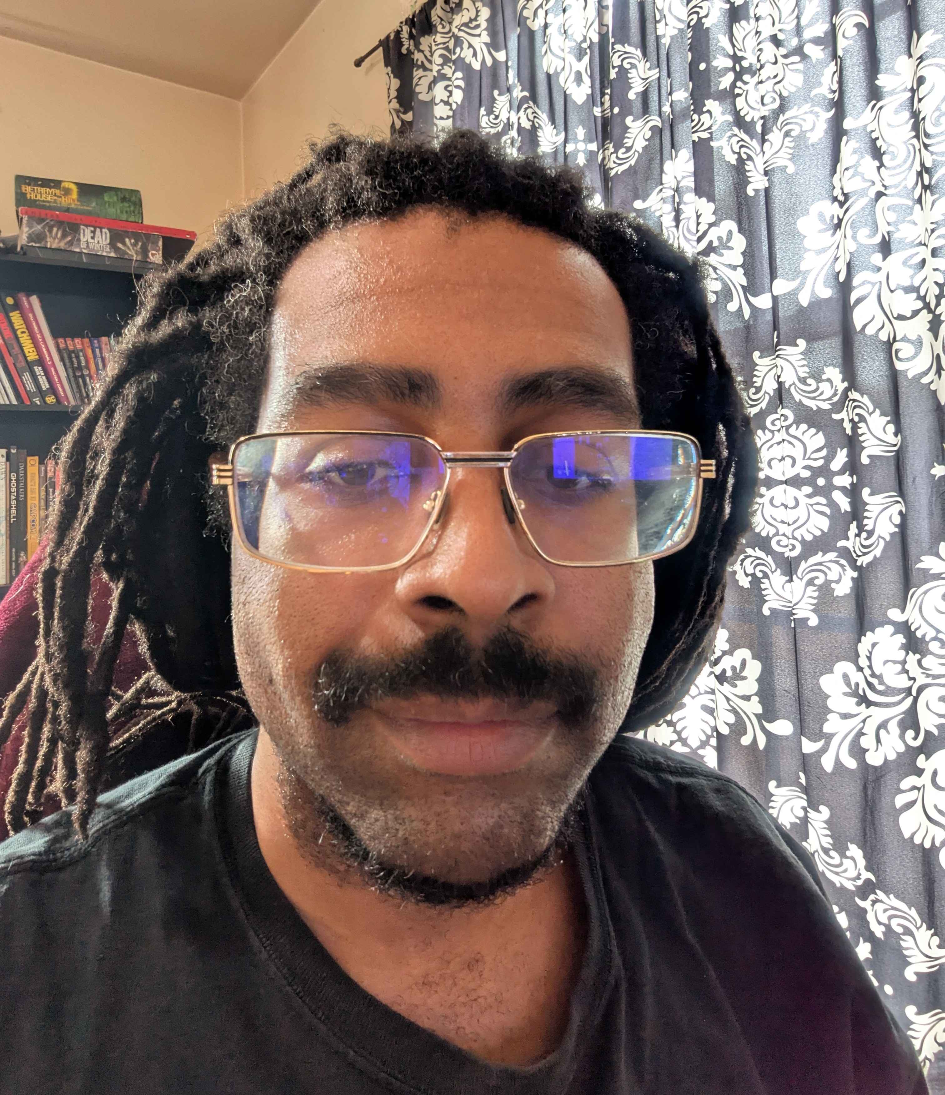 A profile picture of B. Haki Martin, in his office.